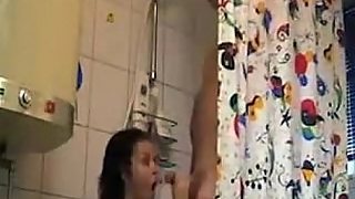 an chick sucking her fat uncircumcised cock at the shower